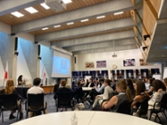 MIRD students listen to a presentation by Visitor Services Officer Yasmin Jamshedzoda at the International Federation of the Red Cross and Red Crescent Societies (IFRC)