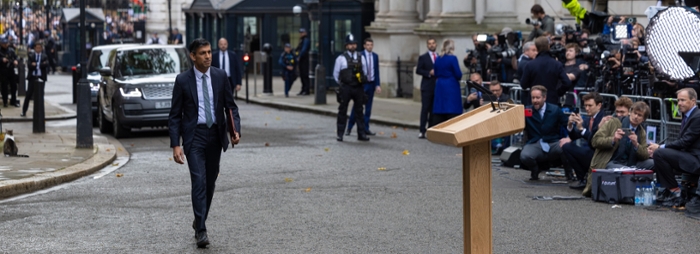 Rishi Sunak walks to the stand for his first speech as the UK prime minister.