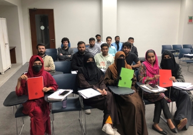 Students sitting in the classroom at the university of Lahore