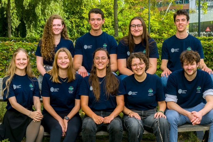The nine students of iGEM Leiden 2025 in two rows.